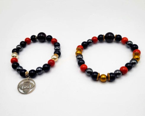 Black tourmaline, obsidian, and garnet chakra healing bracelet with sterling silver accents from Old World Hub Store.