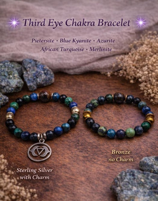 Third Eye Chakra beaded bracelets with natural stones, one with sterling silver charm, one bronze, on wooden surface with crystals.