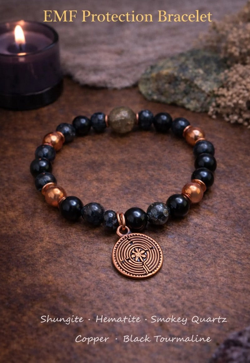 EMF protection bracelet with shungite, hematite, smoky quartz, copper, and black tourmaline beads on a rustic surface, featuring a copper charm.