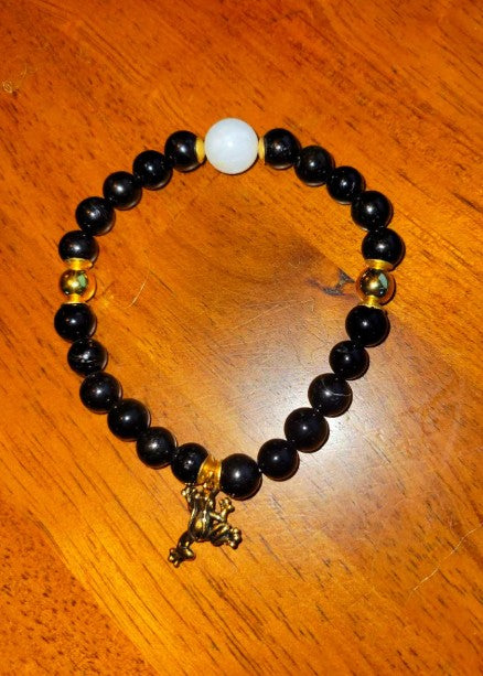 Black tourmaline and moonstone bracelet with beaded design, featuring a silver clasp and spiritual healing energy.