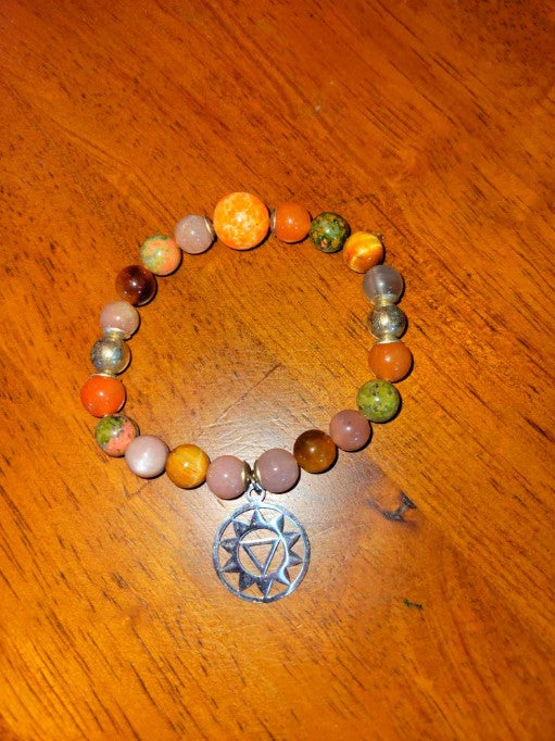 Sacral Chakra bracelet featuring AAA brown moonstone, imperial jasper, orange moonstone, and sterling silver beads.