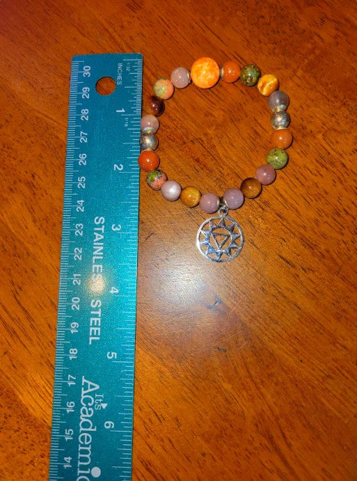 Sacral chakra bracelet with AAA brown moonstone, imperial jasper, orange moonstone, and sterling silver beads.