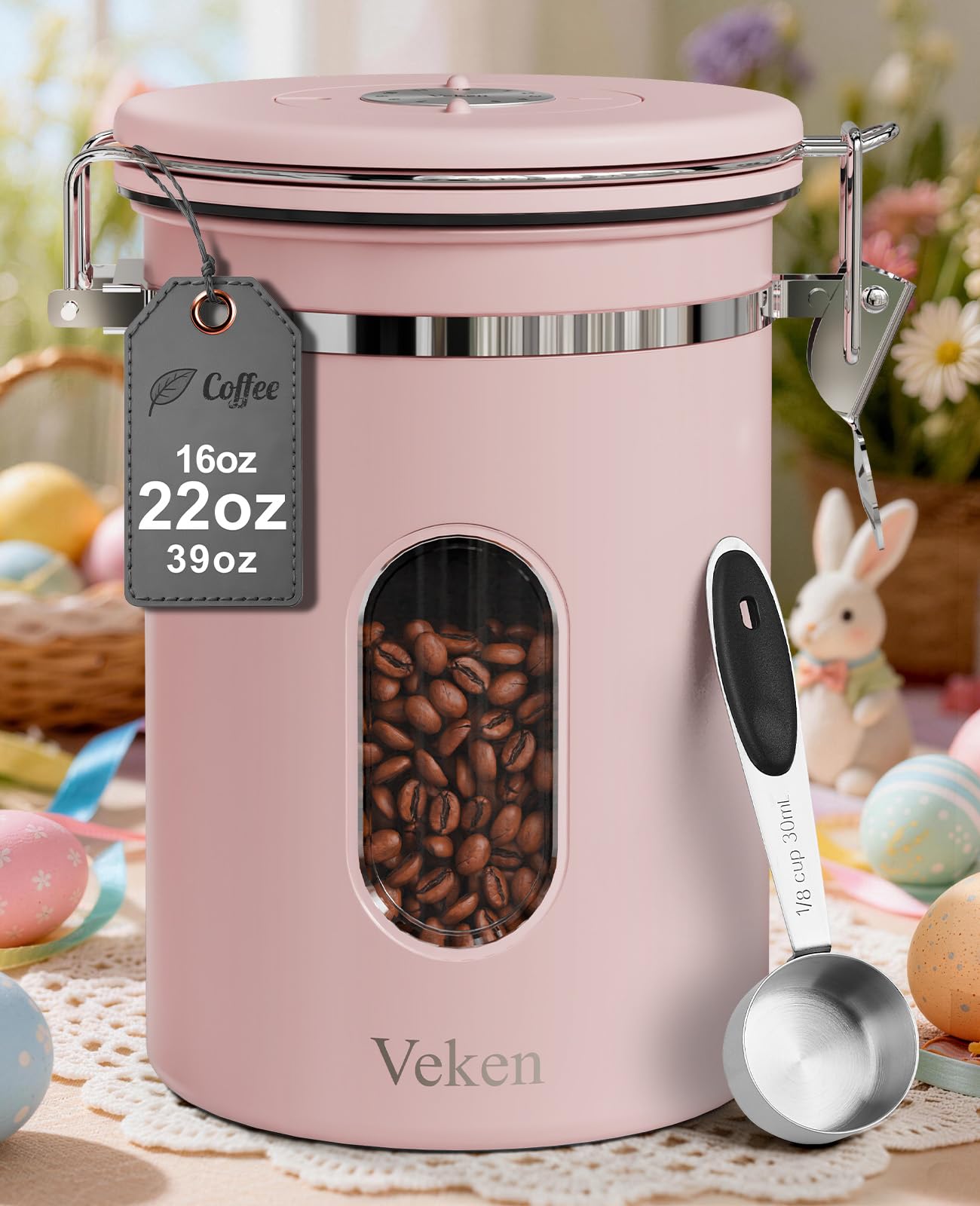 Black Veken coffee canister with window, airtight stainless steel container for coffee grounds, beans, sugar, or cereal in a kitchen setting.