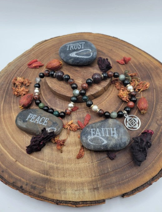 Root chakra bracelet with rainbow obsidian, blood stone, and jet beads, grounding healing energy jewelry for women.