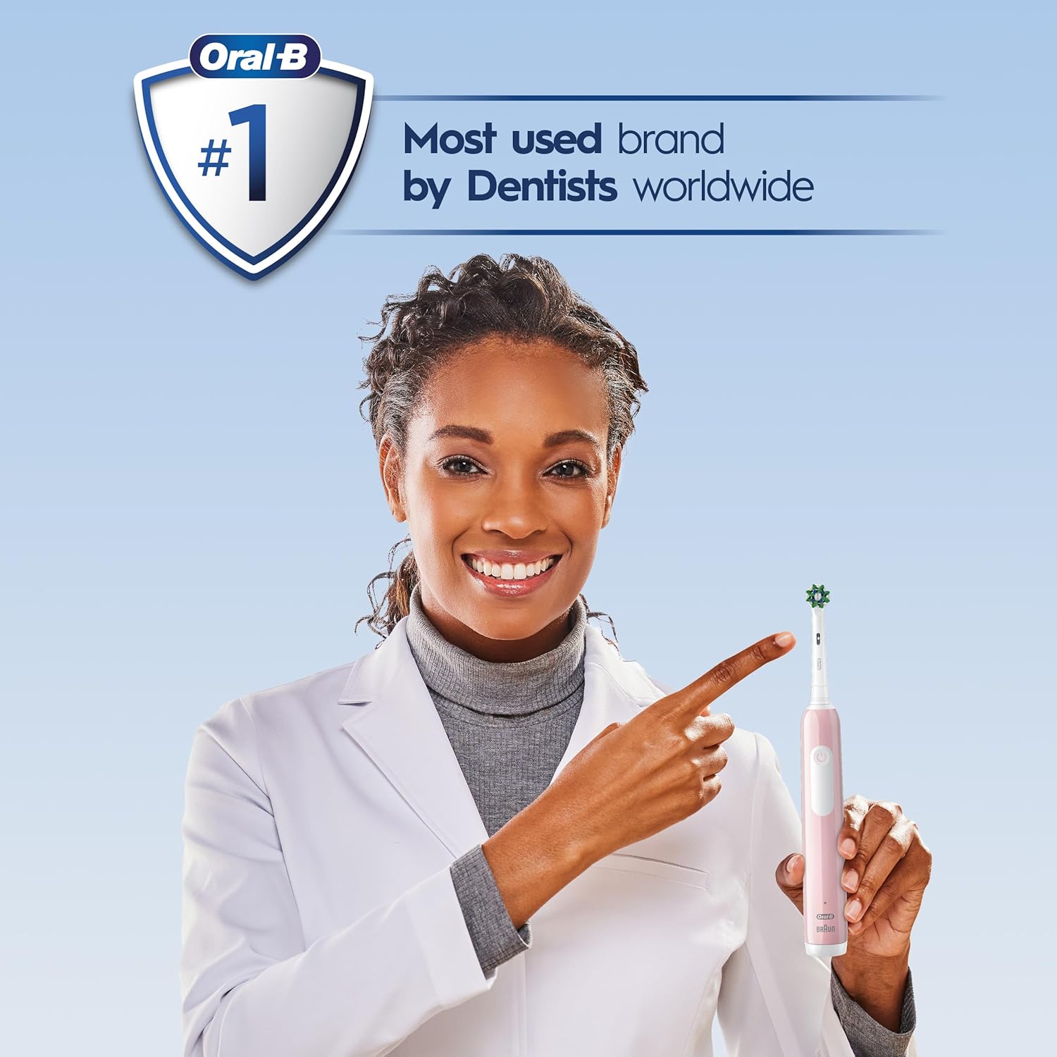 Old World Hub Oral-B Pro 1000 pink rechargeable electric toothbrush with brush head and ergonomic handle.