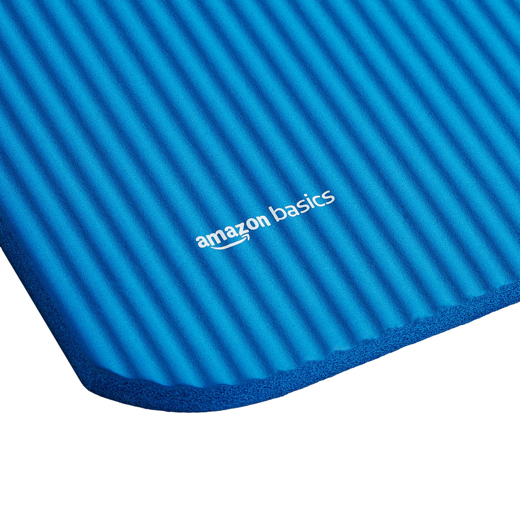 Old World Hub Amazon Basics extra thick yoga mat with carrying strap, showing textured surface and durable design for exercise.